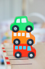 Wall Mural - Vertical shot of plastic car toys for children entertainment place