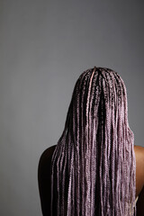 African american woman standing over grey background standing backwards. 