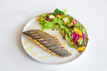 dish grilled fish vegetables avocado salad orange