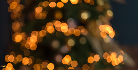 Canvas Print - 
Abstract shimmering lights background with defocused gold and yellow bokeh lights. Valentine's day, party, Christmas background.