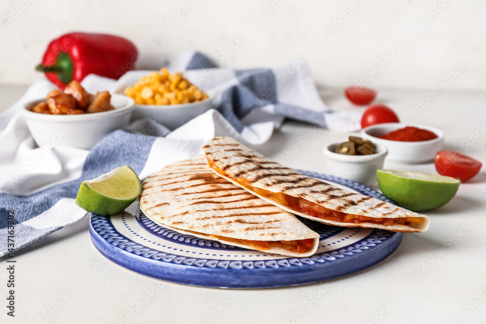 Plate with tasty quesadillas on light background, closeup