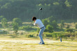 © freebird7977 - Golfer sport course golf ball fairway.  People lifestyle man playing game and swing golf tee off on the green grass.  Asian man player game shot in summer.  Healthy and Sport outdoor