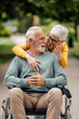 © bnenin - Mature disabled man, enjoying the fresh air with his wife.