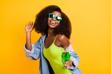 Sticker - Photo of pretty charming dark skin lady dressed denim outfit glasses drinking alcohol dancing isolated yellow color background