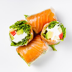 appetizing spring rolls with sea food and philadelphia cheese on a white background