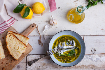 Wall Mural - Marinated anchovies in lemon juice with olive oil garlic and parsley