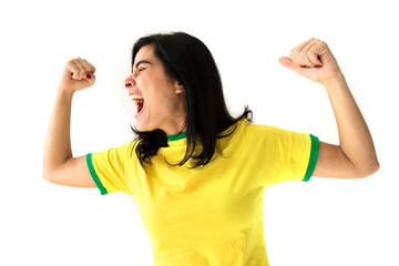 Sport fan Cherring. Beautiful brunette girl in yellow uniform. Woman celebrates sports and game over white background.