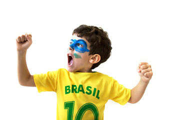 Brazilian boy, soccer player and fan, celebrates making a gesture with his hands over white background.  Sports fan cherring.