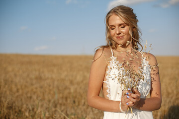 Wall Mural - Beautiful elegant girl in a autumn field