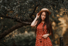 Young Girl In Retro Dress Posing In Nature.
