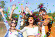 © Monstar Studio - Happy excited friends having fun outdoor celebrating with confetti - Young millenial people enjoying summertime together at garden party - Cheerful friendship concept. Party - festival concept.