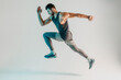 © Ivan - Young concentrated european male runner in studio