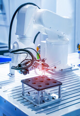 robot arm with test tube with biological sample in science laboratory