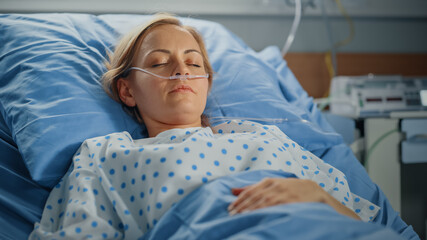 Wall Mural - Hospital Ward: Portrait of Beautiful Young Woman Sleeping in Bed, Fully Recovering after Sickness. Female Patient Dreaming About Her Happy Healthy Future.