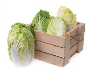 Wall Mural - Fresh green Lettuce leaves in wooden box isolated on white