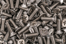 Stainless steel phillips flat head screws. Macro photo high resolution close up photo.