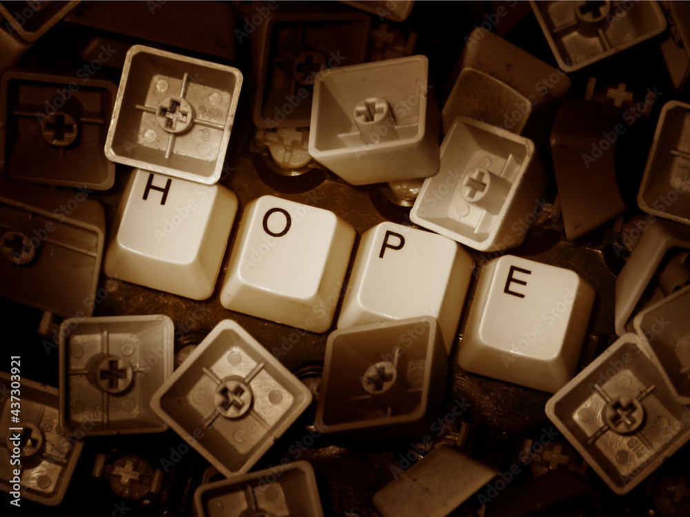 Hope in chaos. Loose keyboard keys forming the word hope. Symbol of ...