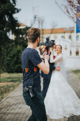 Sticker - Shallow focus shot of a wedding photographer takes pictures of the bride and groom