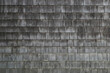 © R. Berube - Wet aged weathered cedar shingle siding texture on an old summer cottage home building
