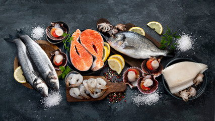 Canvas Print - Seafood variety on dark background. Healthy diet eating concept.