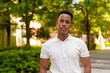 © Ranta Images - Portrait of young African businessman wearing casual clothes in park