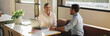 © Jacob Lund - Business professional talking with coworker