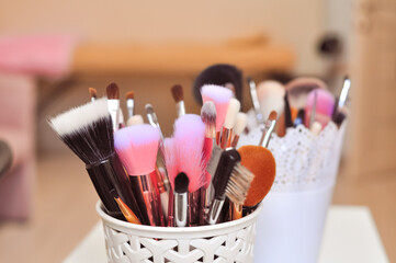 Wall Mural - Professional brushes for applying make up in beauty salon 