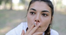 Portrait Of A Woman Smoking Cigarettes