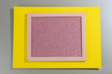 Poster - pink shiny rectangular frame on gray-yellow background with shadow