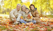 © aletia2011 - Happy family relaxing in autumn forest