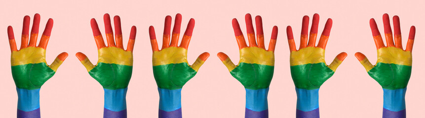 Sticker - raised hands painted as the gay pride flag, banner