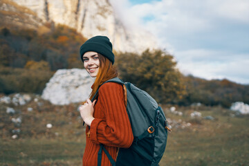 woman hiker walking in nature rocks travel vacation