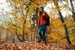 © SHOTPRIME STUDIO - young woman in jeans and a sweater with a backpack on her back walks in the park in autumn in nature, bottom view