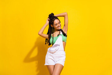 Photo of charming happy dark skin young woman good mood summer season isolated on yellow color background