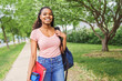 © Louis-Photo - cute black teenager university student on campus with backpack