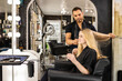© SuperStock - Stylist consults with young woman before hair appointment at boutique salon