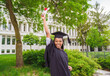 © Louis-Photo - happy afro american university graduates at graduation ceremony
