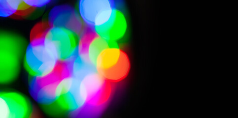 Colorful blurred lights bokeh effect in the dark