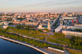 Fototapeta Miasto - Aerial view of Perm and historical building, Kama river with bridge in sunny summer day with green trees in the sunset