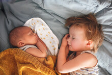 Cute Baby Siblings Sleep Together, Newborn Baby And Toddler Older Sister, Sibling Relationship In The Family When The Youngest Was Born