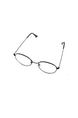 isolation glasses on white background. round black metal eyeglass frame in the photo from above on a white background