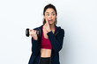 © luismolinero - Sport woman making weightlifting over isolated white background whispering something
