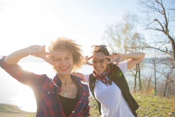 Two beautiful girls are traveling in the mountains