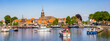Panorama of historic village Blokzijl in summertime, with boats wating for the lock in the Netherlands
