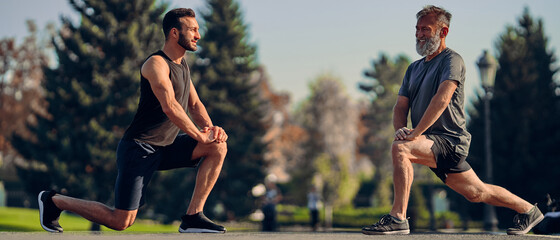 Sticker - The young and old athletes stretching outdoor