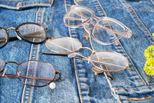 Yellow Wildflowers And Multiple Eyes Glasses On A Blue Denim Jacket, Trend Eyes Glasses, Retro Style