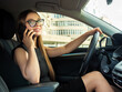 Modern beautiful woman businesswoman talking on the phone in her car.