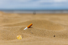 Natural Beach With Cigarette Butt Litter