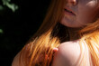© ullision - Mouth shoulder and hand of young sexy woman redhead playing with her long red hair, copy space
