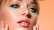 © Valua Vitaly - Face of an young girl close-up with a green color makeup. Stylish makeup.